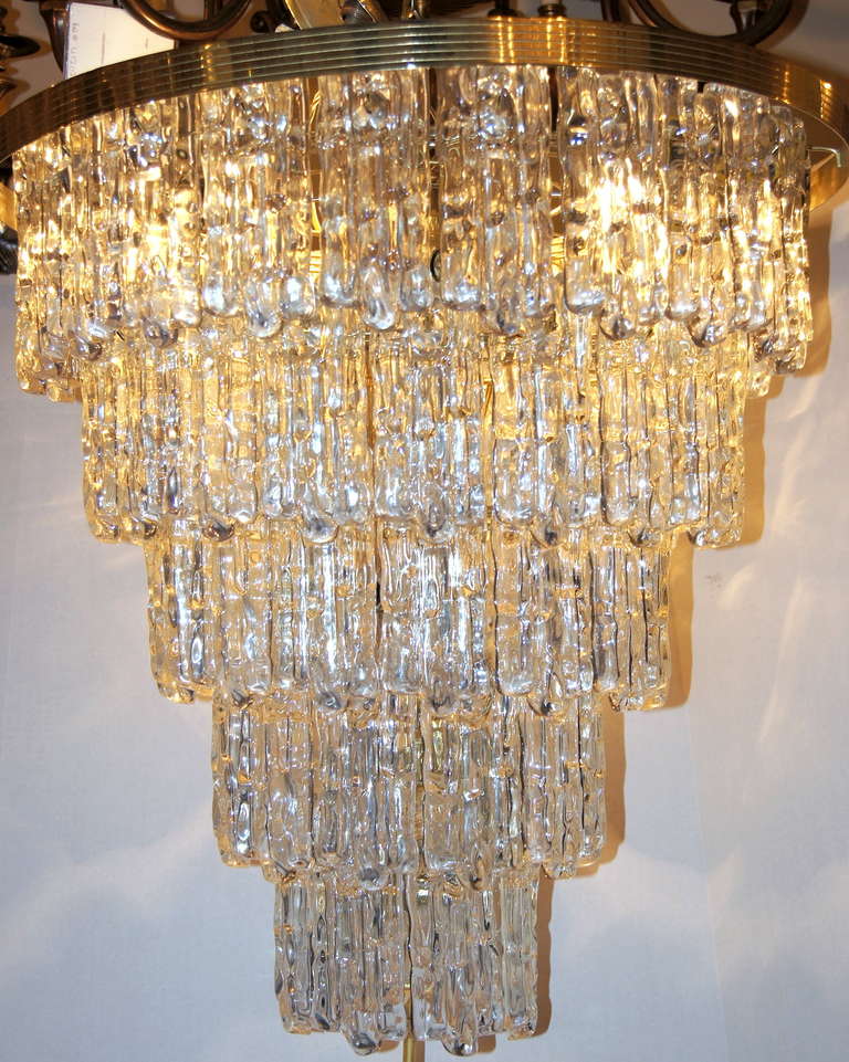 A circa 1960 Italian lucite light fixture with gilt body with 15 interior lights.

25