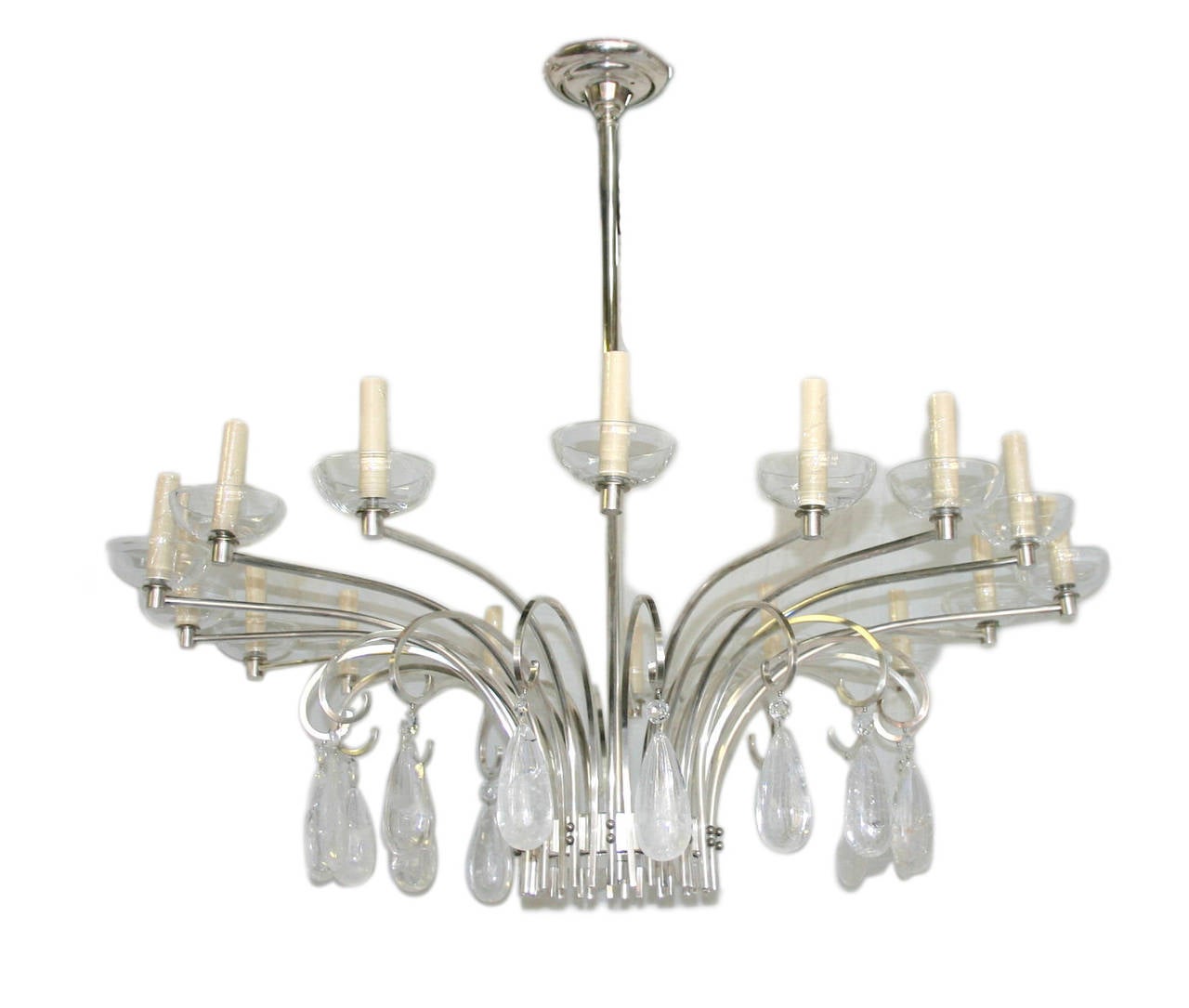 An Italian sixteen-light silver plated chandelier with Lucite bobeches and rock crystal hangings, circa 1960s.
Measurements:
40