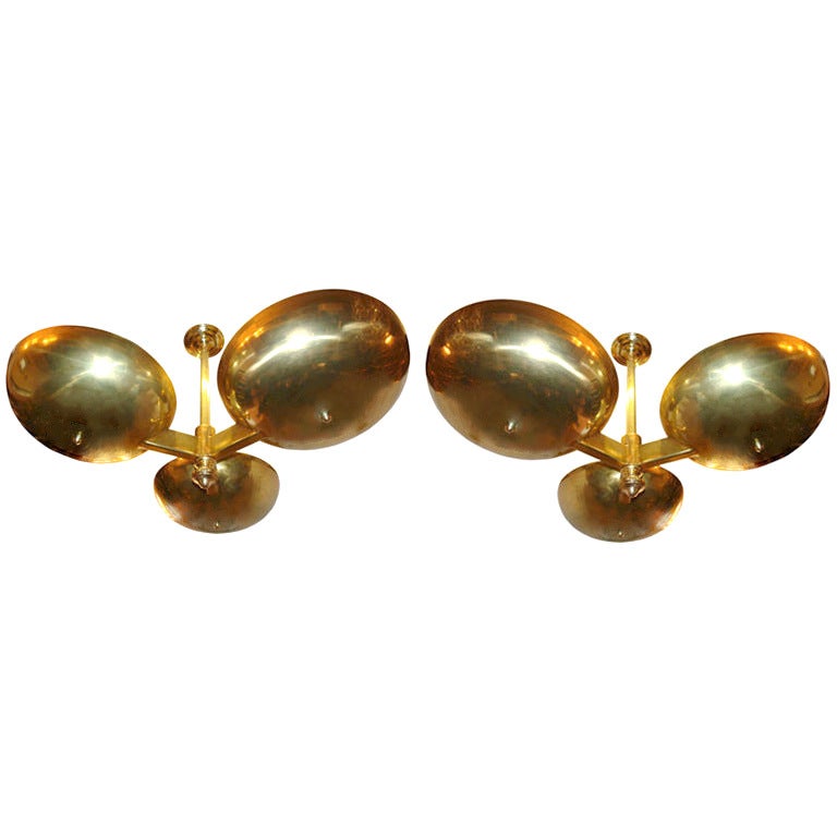 A set of large circa 1960s Italian polished brass light fixtures with 12 interior lights. Sold individually.

Measurements:
Height 24