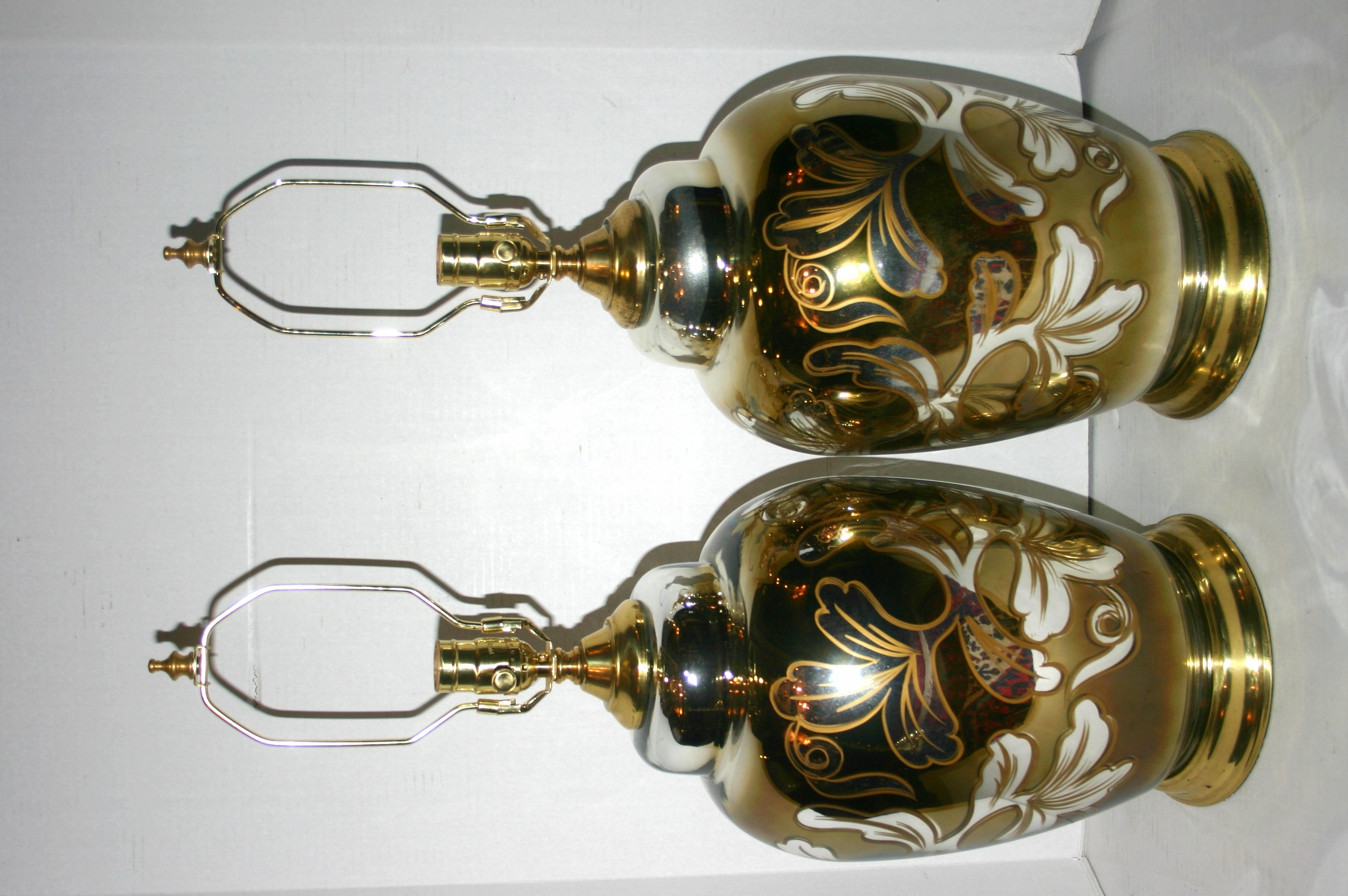 A pair of 1940s French mercury glass lamps with enameled hand-painted decoration.

Measurements
Height of body 17