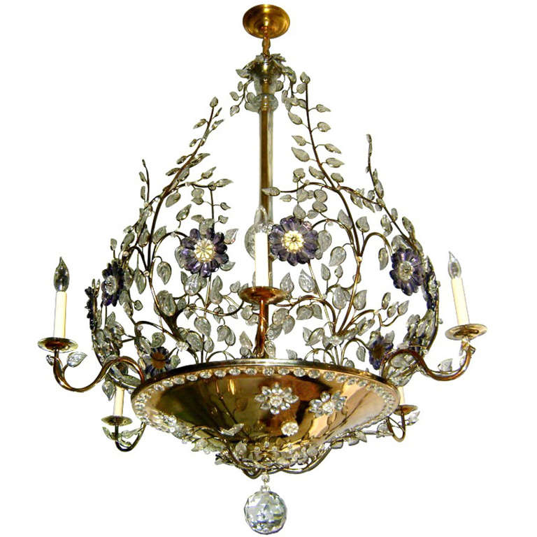A pair of 1940's French gilt metal chandeliers with 8 arms each and 8 interior lights each. Branches coming out of the central body, with molded glass leaves and clear and amethyst crystal flowers. The bottom central body has crystals that let the