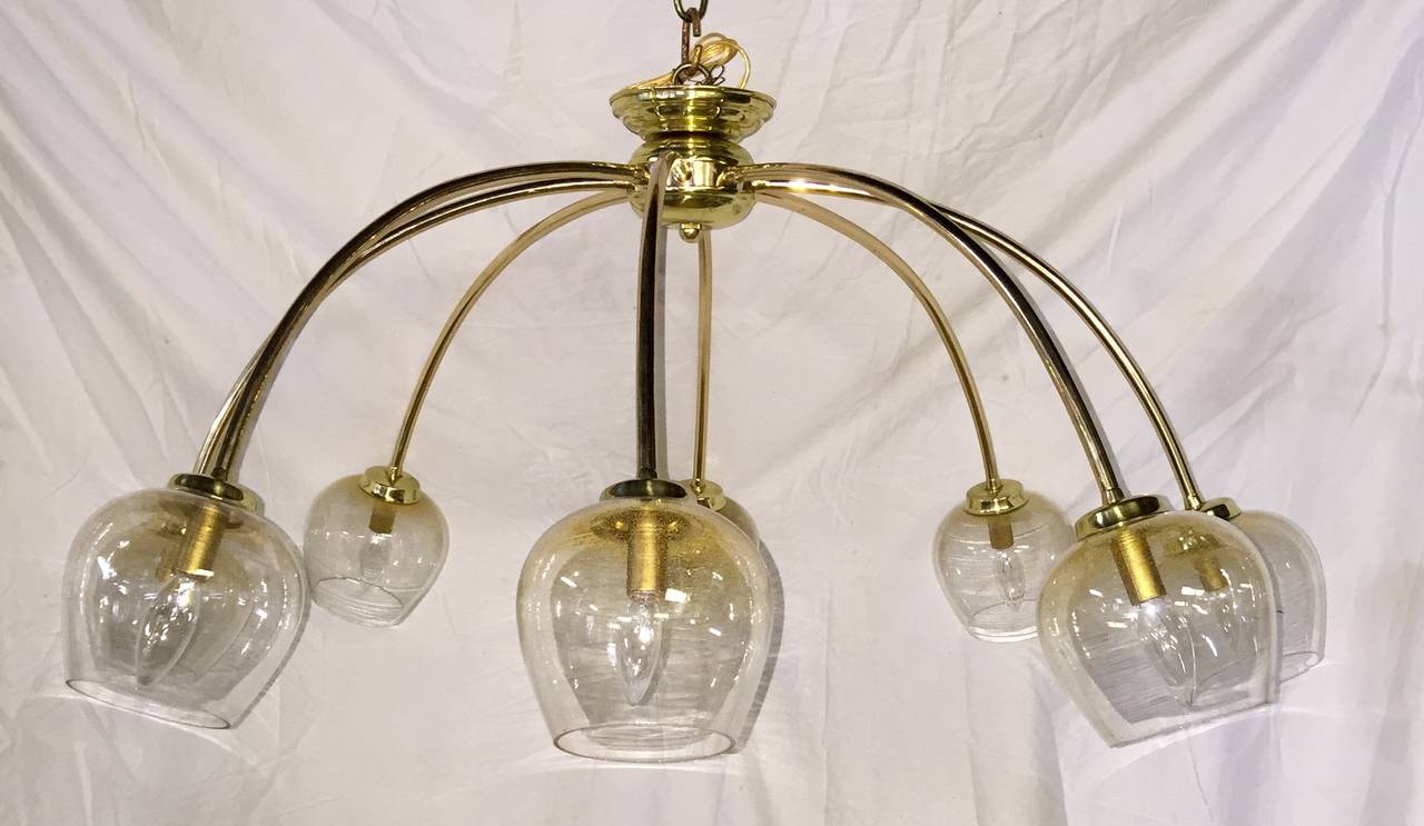 An Italian gilt metal light fixture with glass globes, circa 1960s. Eight candelabra lights.

Measurements:
43