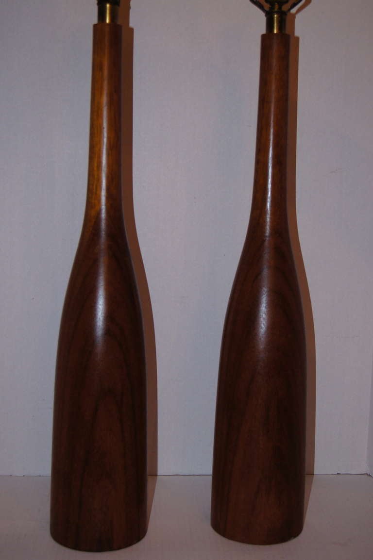 Pair of 1960's Danish carved wood lamps with original patina.

Measurements:
Height of body: 26