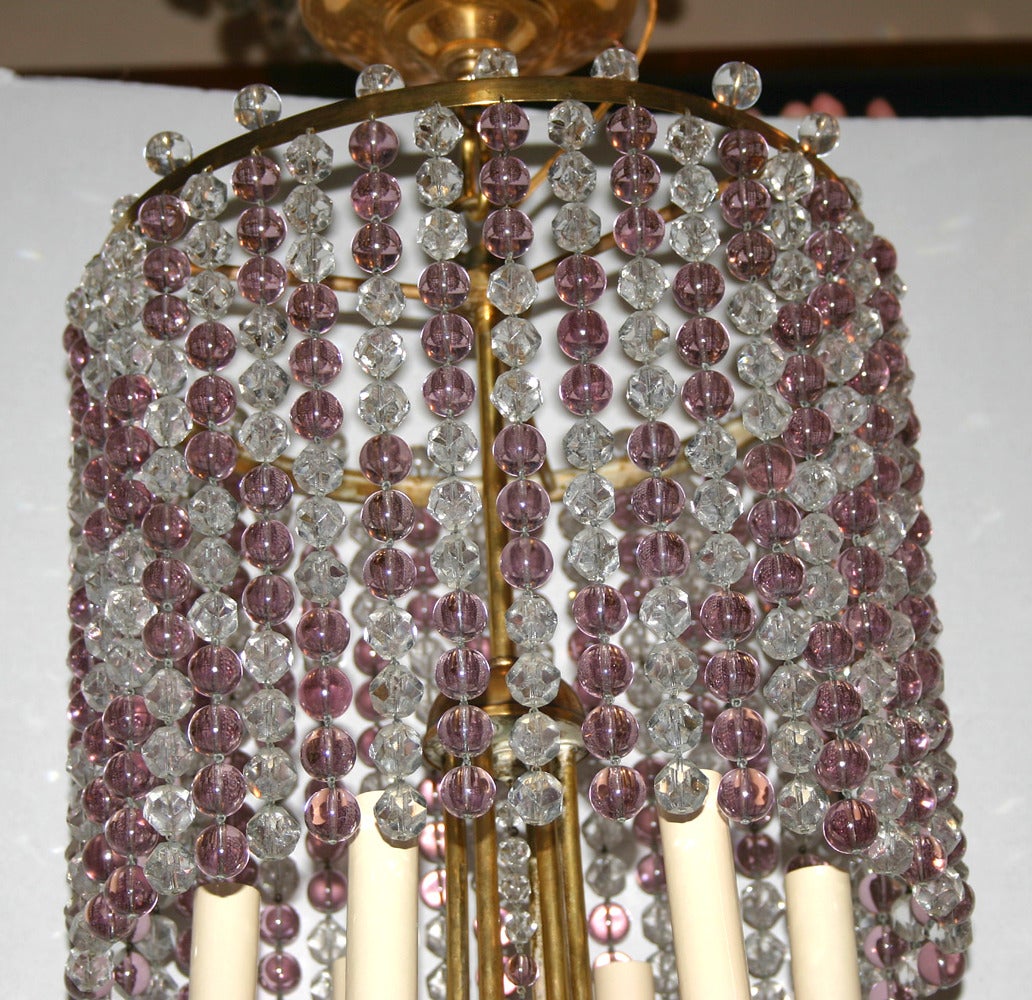 Pair of 19340's gilt light fixtures with amethyst crystals.