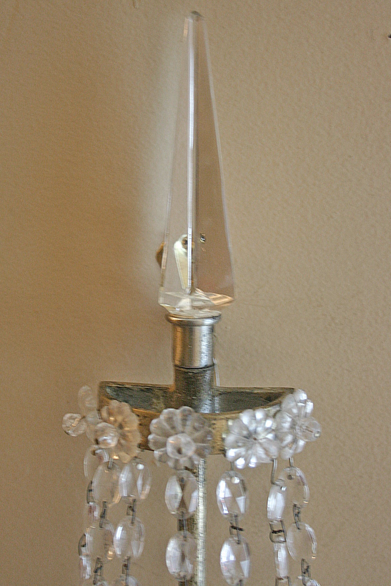 A pair of silver plated single light sconces with crystal body. Two interior lights, could be wired to four interior lights.
Measures: 23