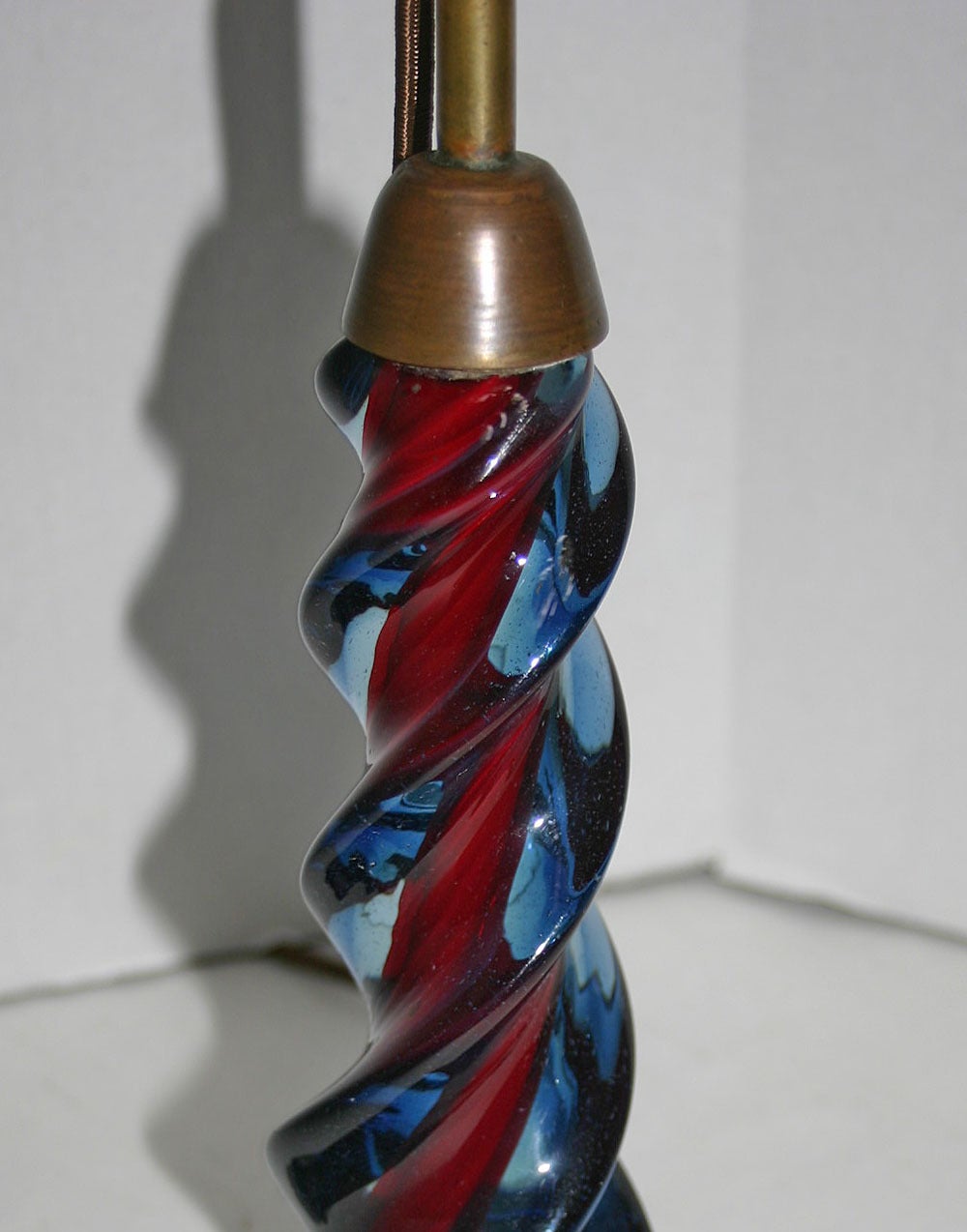 An Italian, circa 1940s twisted blue to red Murano glass table lamp.
Measurements:
10