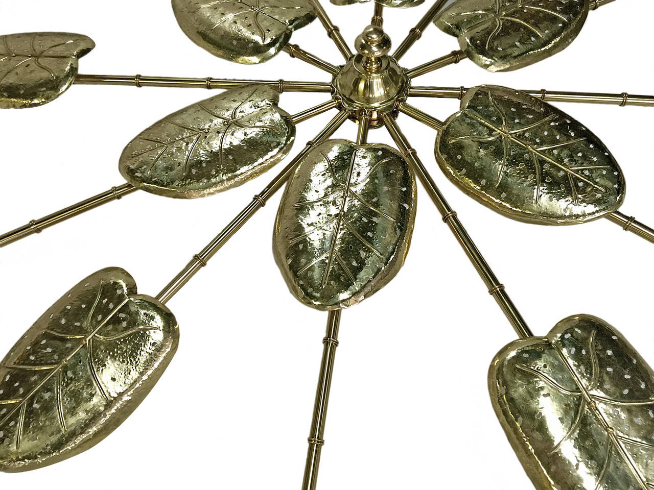 A large circa 1960's Italian polished brass flush-mounted fixture with 18 leaf shaped applied elements and 36 lights.

Measurements:
Diameter: 93