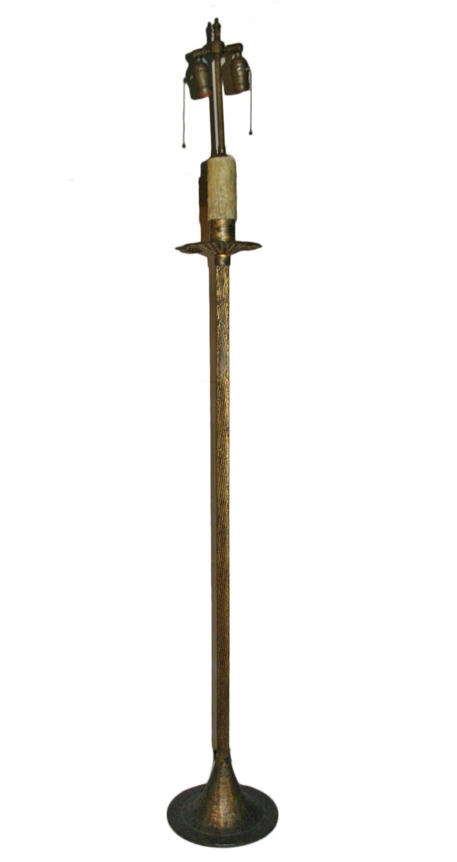 A circa 1930's French Gilt metal floor lamp.

Measurements:
Height of body: 54