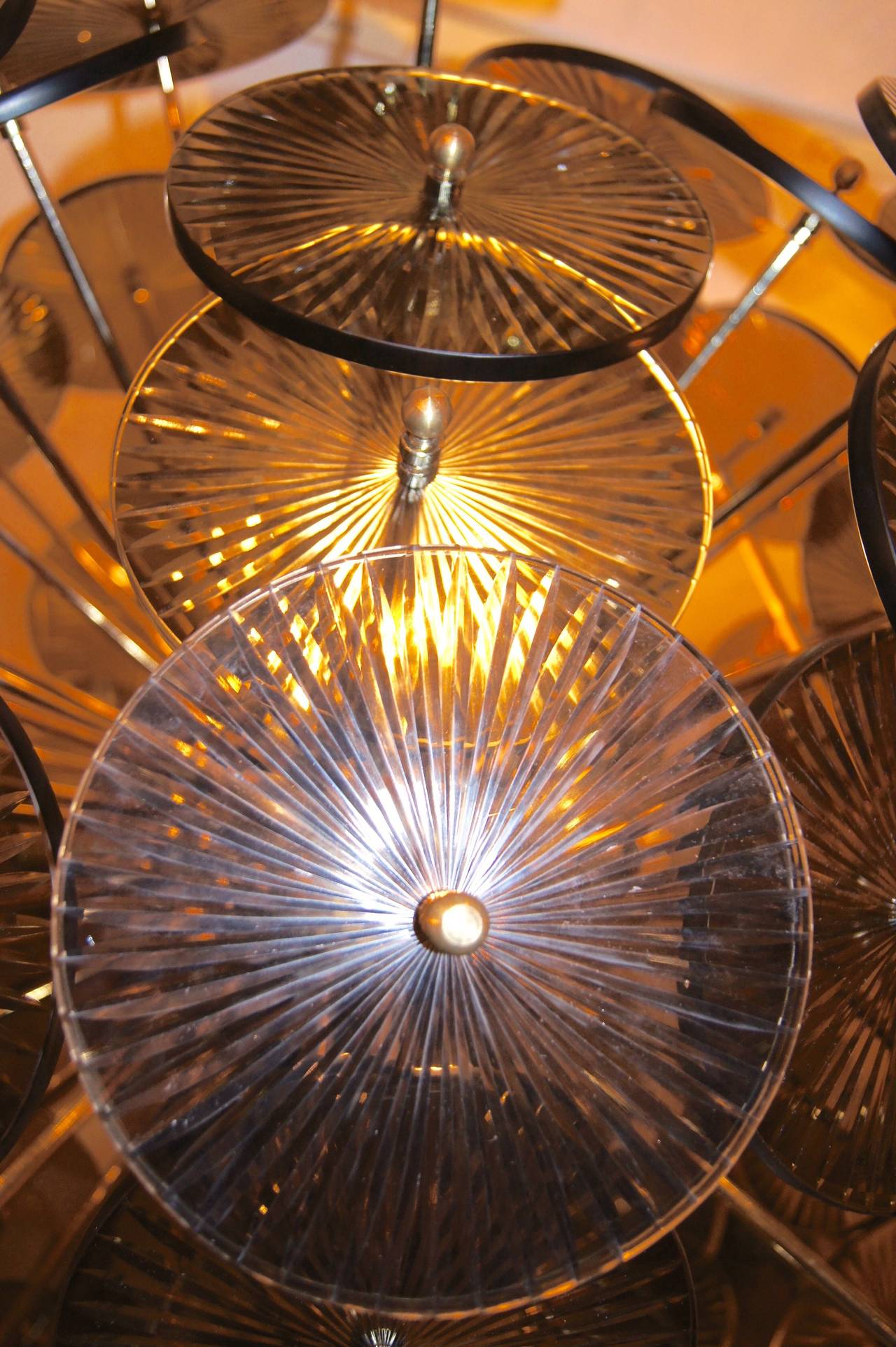 A large, circa 1980 French Sputnik light fixture with smoke colored glass fittings. 
The body in gilt bronze.
18 lights.

Measures: 36" min. drop, 36" diameter.