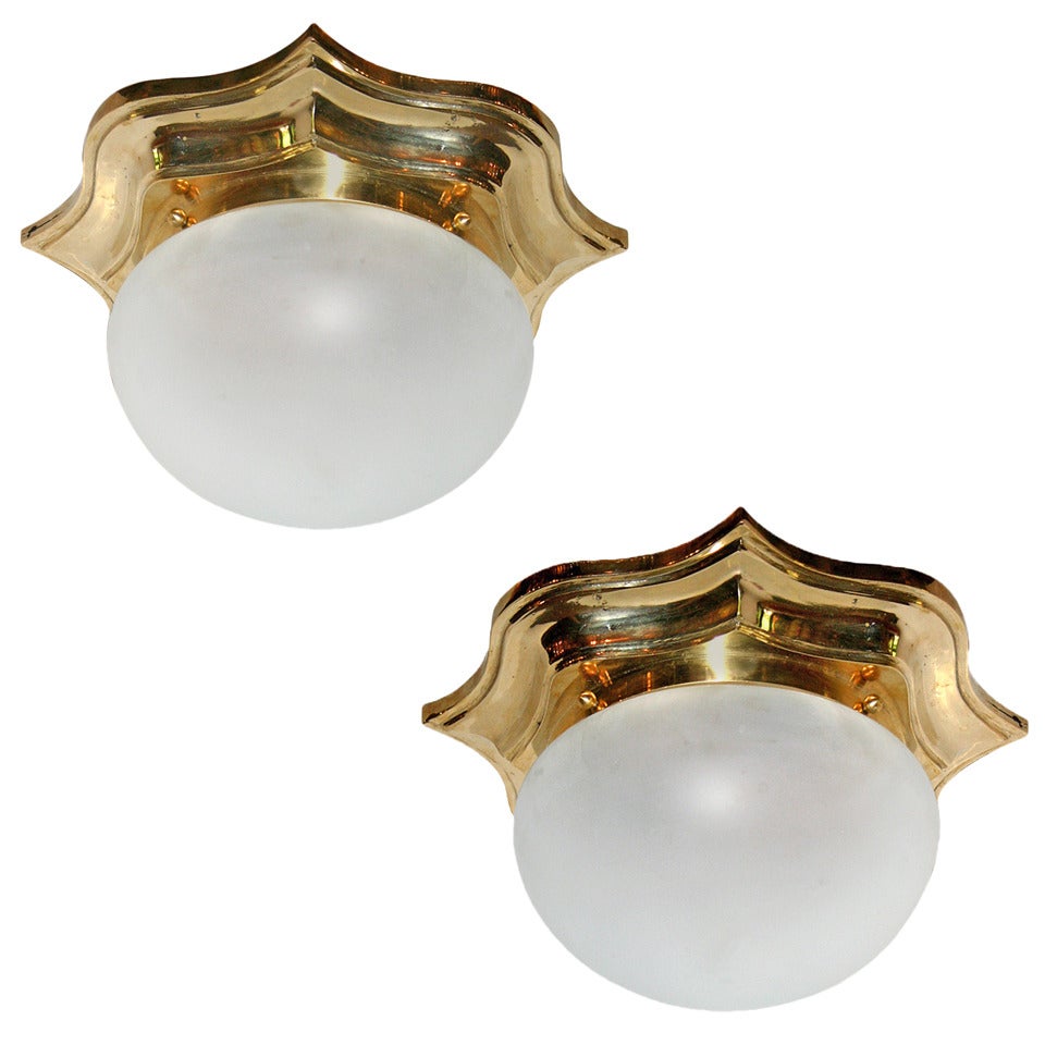 A matching set of thirteen circa 1940's Italian neoclassic-style cast bronze flush-mounted light fixtures with frosted glass inset and single interior light. Sold individually.

Measurements:
Diameter: 13