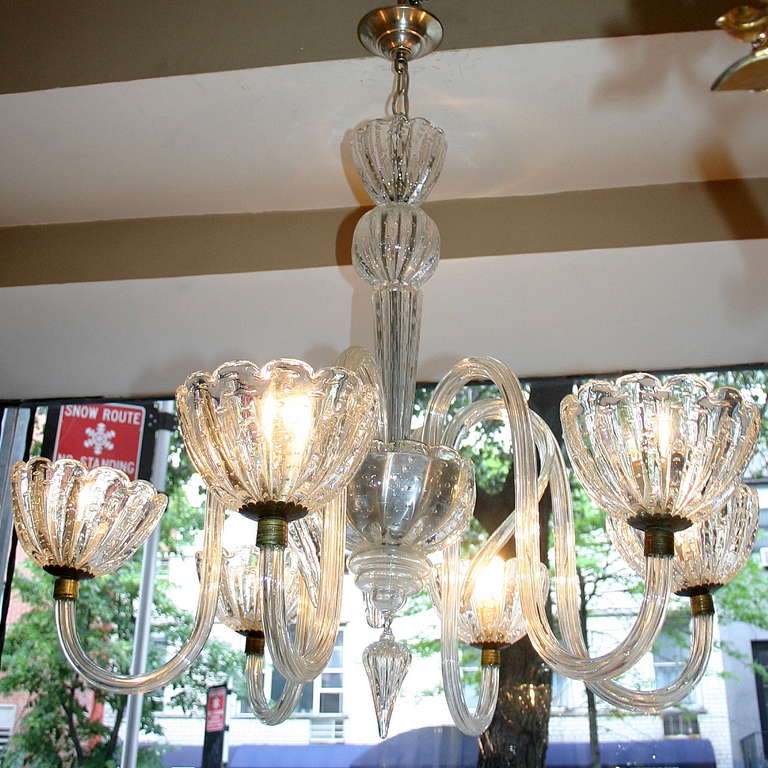 A circa 1940s Italian Murano chandelier with 6 lights, the body and cups with controlled bubble insets.

36.5