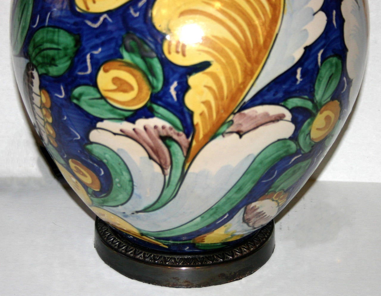 An Italian porcelain lamp with foliage motif, circa 1920s.

Measures: 12 3/4