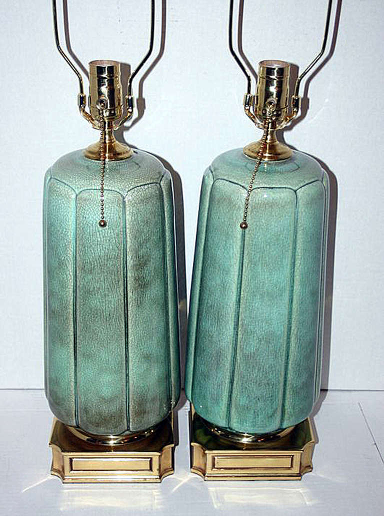 Pair of 1940s French crackled celadon porcelain table lamps with bronze bases. 
Measurements:
16 3/4
