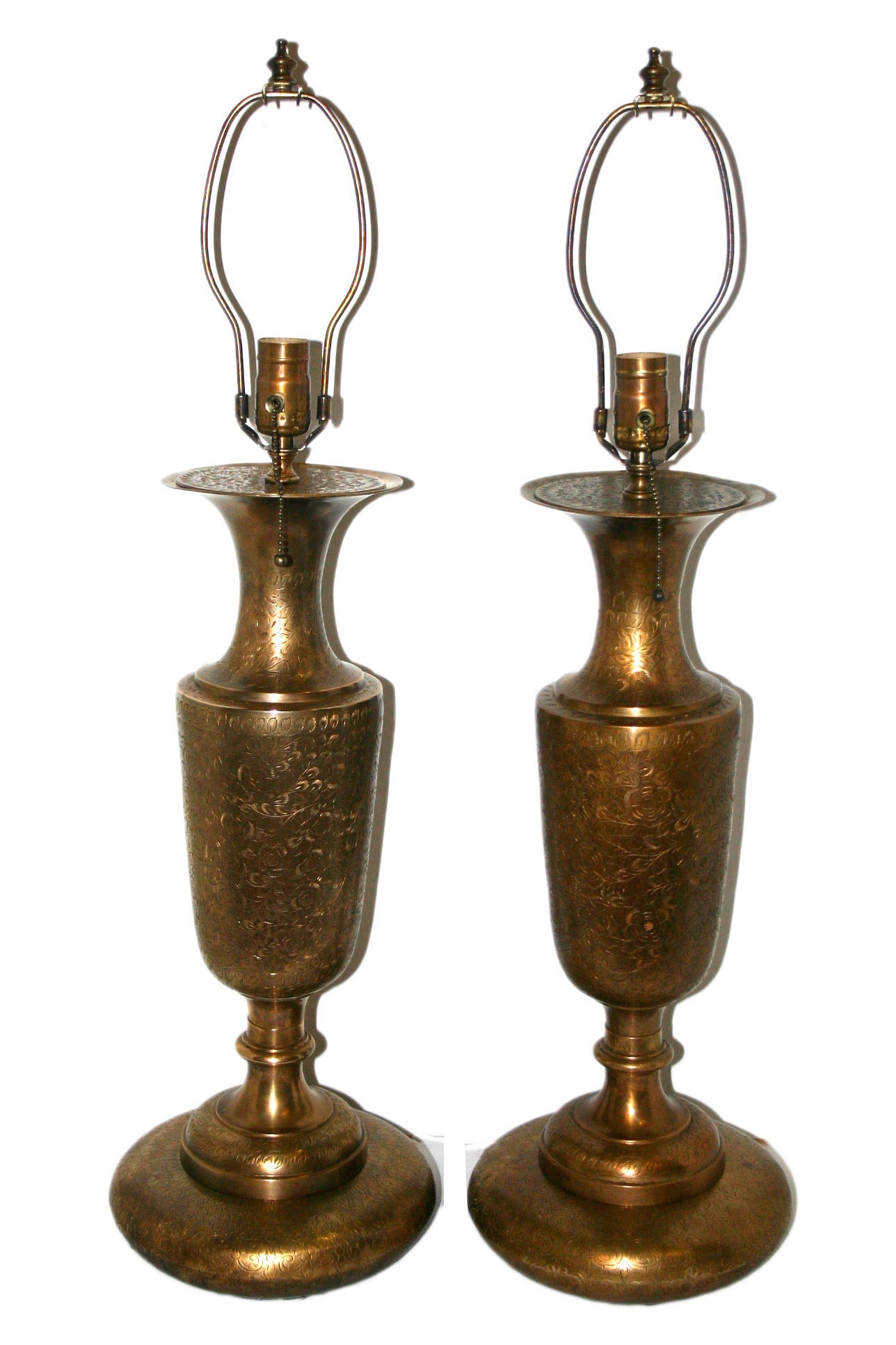 Pair of Turkish etched brass table lamps with foliage motif, circa 1920s.

Measurements:
Height of body: 20.5