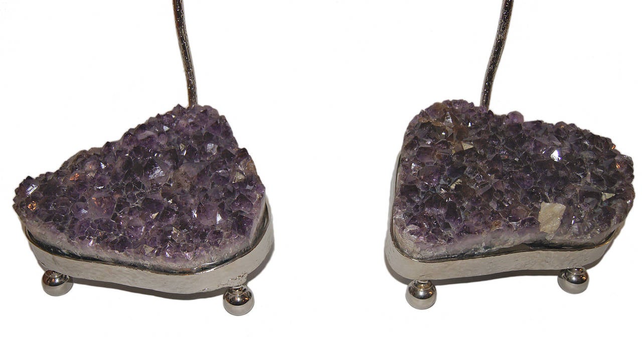 A pair of circa 1960s silver finish Italian table lamps with amethyst stones.
Measurements:
26