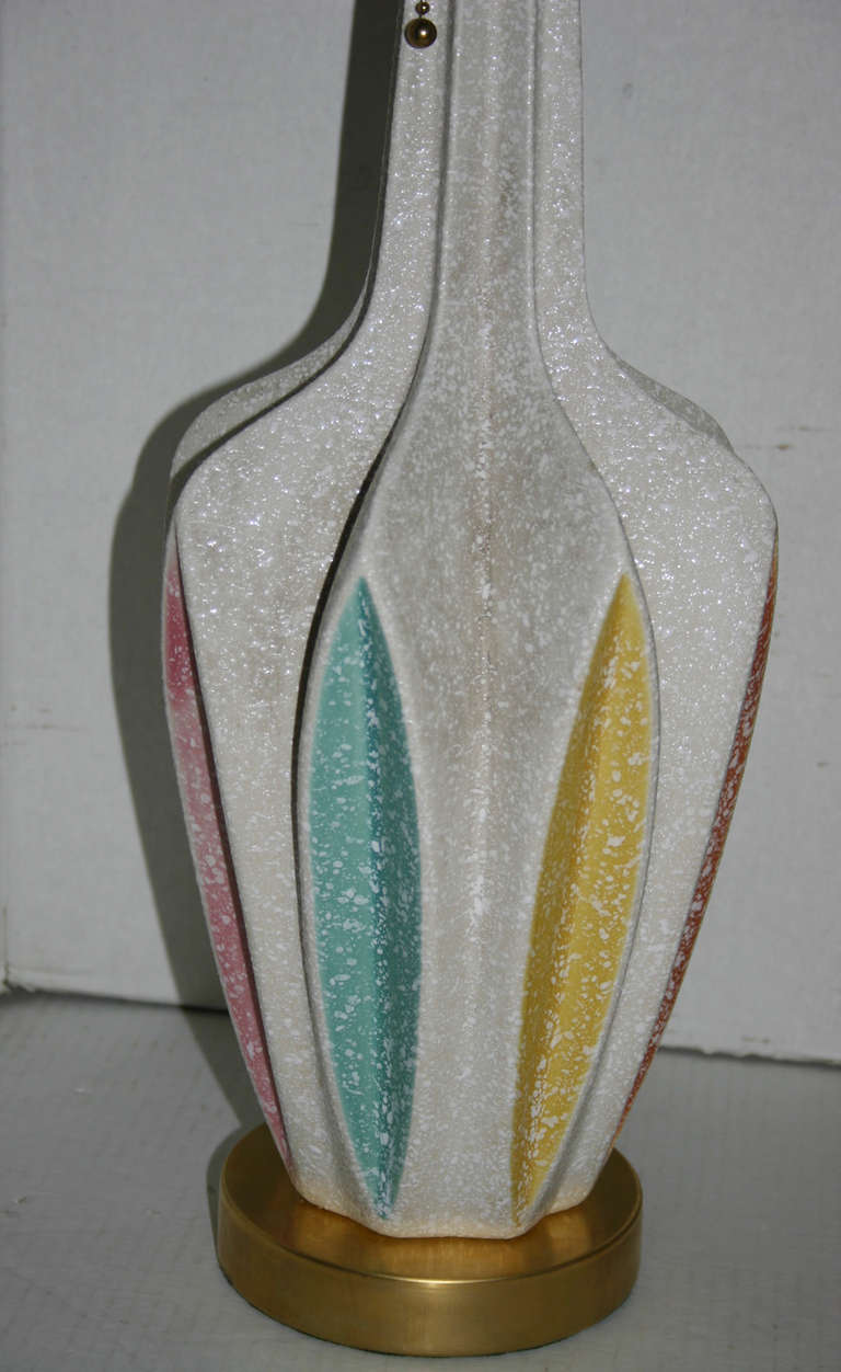 Pair of 1960s Italian ceramic table lamps with different colors on a white background.