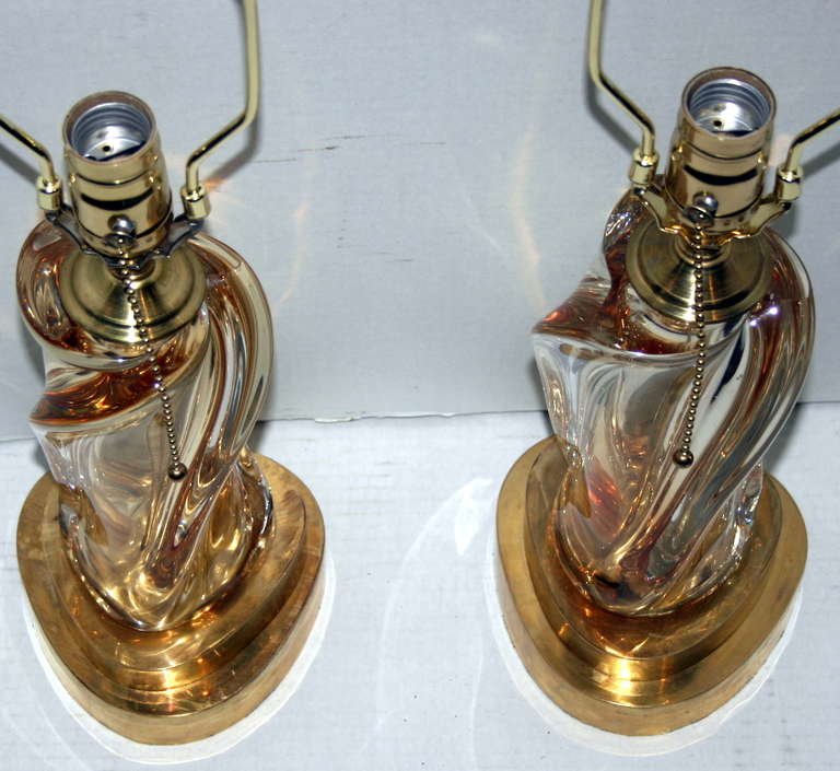 A pair of circa 1950’s Murano glass lamps with gilt bases.

Measurements:
Height of body: 10″
Diameter of base: 5.5″