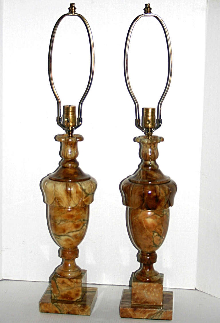 Pair of large, circa 1940s Italian amber colored alabaster lamps.
21