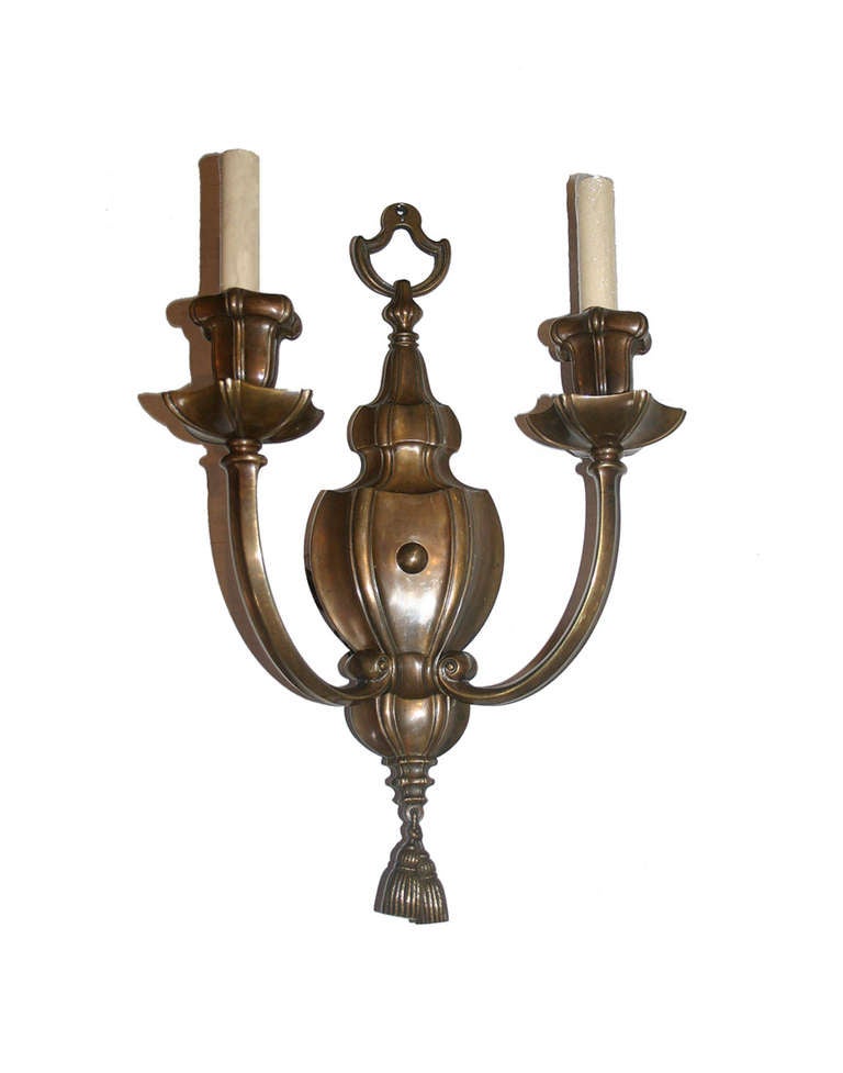 A pair of circa 1920's neoclassic style Caldwell bronze sconces with original patina.

Measurements:
Height: 18