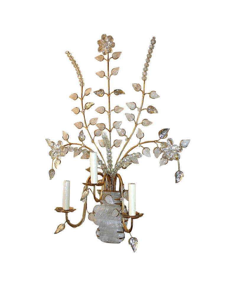 Pair of large French gilt metal sconces with rock crystal quartz body and leaves. Crystal flowers, mirrored leaves on a gilt metal body.
Measurements:
Height: 33″
Width: 22″
Depth: 8″

