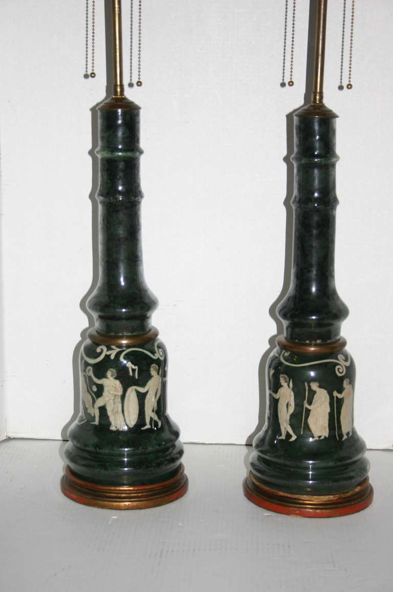 Pair of 1940s French neoclassic style lamps with eglomise decoration on a dark green background.
Measures: 21? height of body.