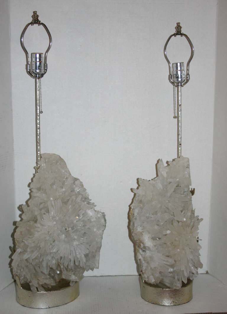 Pair of 1940s French quartz specimen table lamps with silver plated bases. Original patina.

Measures: 31 height to rest of shade, 10 diameter.
