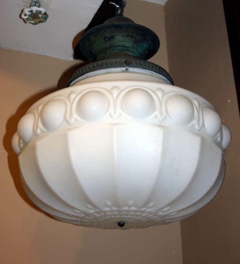 Pair of 1920′s milk glass English lanterns with neoclassic motif on glass, patinated copper fitters
Measures:
Diameter: 17