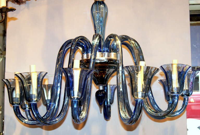 A large circa 1940's blue Murano glass chandelier with 10 lights.

Measurements:
Height: 48