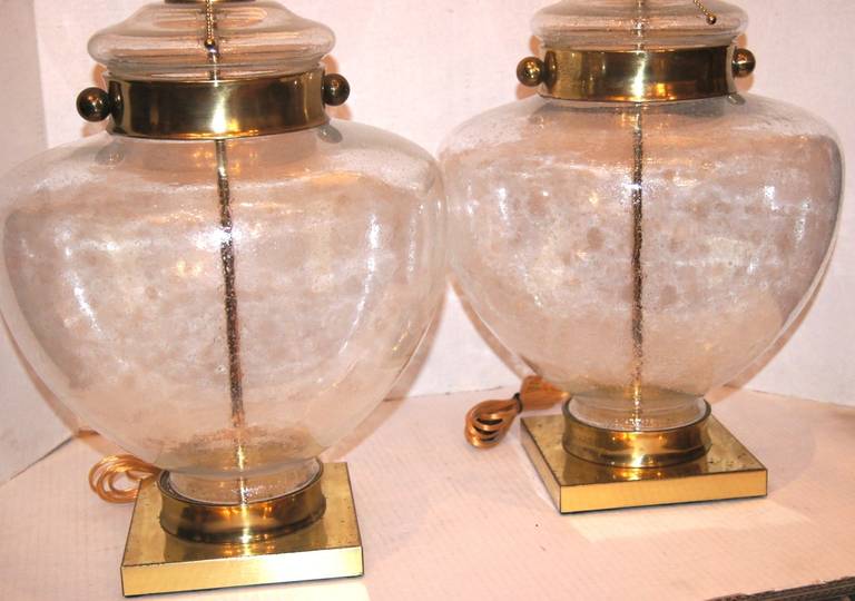 Pair of 1960's Italian blown glass table lamps with polished brass fittings and base. 
19