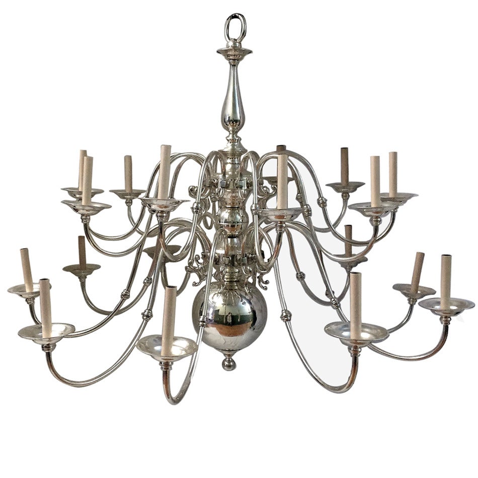 A large, circa 1920s English double tiered silver plated chandelier with 18 lights arranged in two levels.

Measurements:
Diameter 56