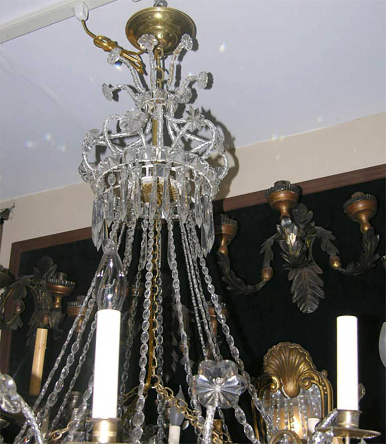 A Swedish neoclassic eight-light crystal chandelier with woven crystals, with all original pendants and patina. 

Measures: Height 41 in.
Diameter 33 in.