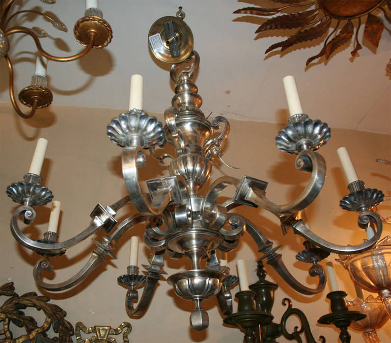 A circa 1910 neoclassic style, 8 light, Italian silver plated chandelier. 
Original finish and patina.

Height: 40 in.
Diameter: 33 in.