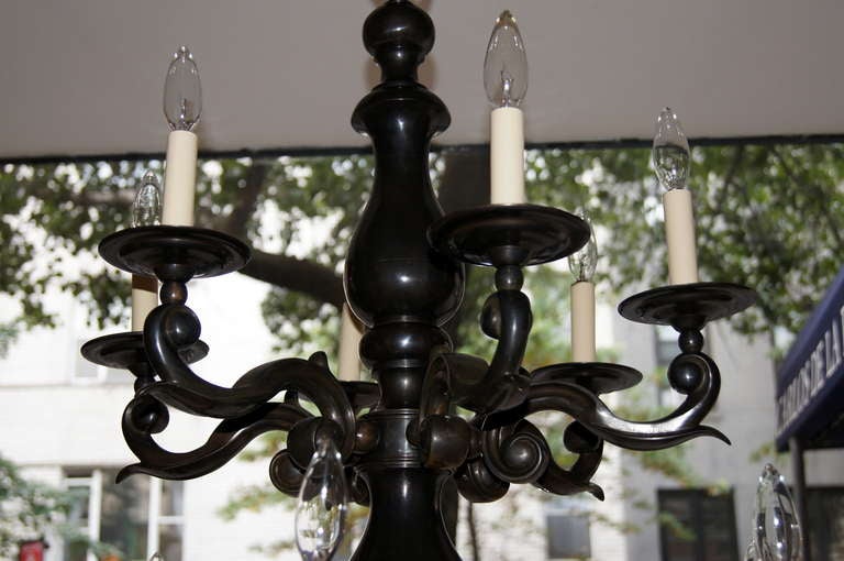 A large, double tiered, 12 lights Dutch chandelier with original patina.