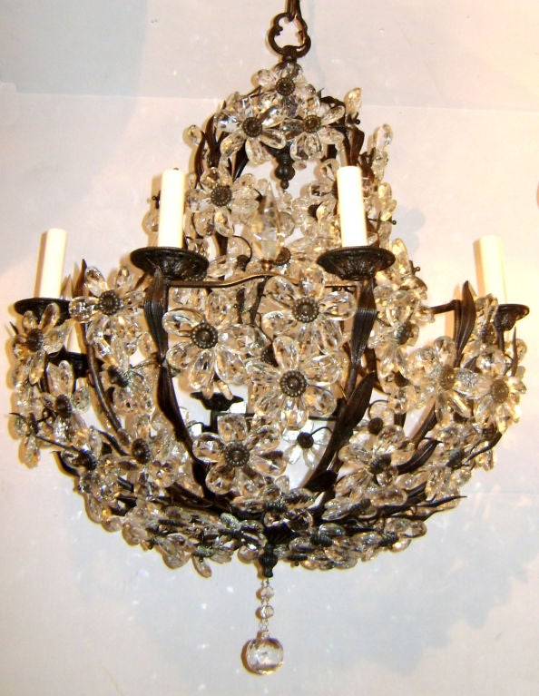 Circa 1920's French eight-arm chandelier with crystal flowers and original patina.

Measurements:
Height (minimum drop): 32