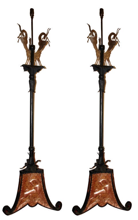 Pair of 1920s Arts and Crafts iron and copper floor lamps with rams motif on body and base.  80