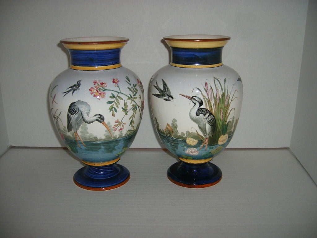 Pair of porcelain vases with painted decoration of landscapes with birds, Italian, 1920s.