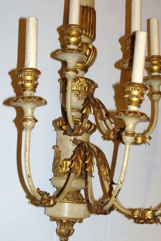 Pair of 1940s large Italian carved and painted wood sconces with seven lights, each.