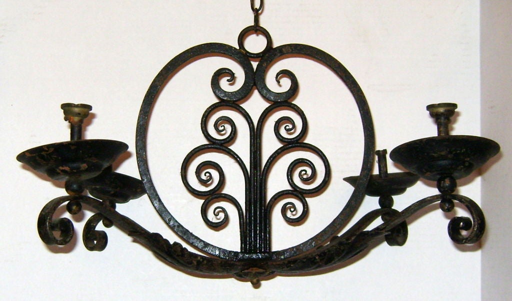 A circa 1900 French wrought iron chandelier.

Measurements:
Height 14? (minimum drop)
Diameter 22?.