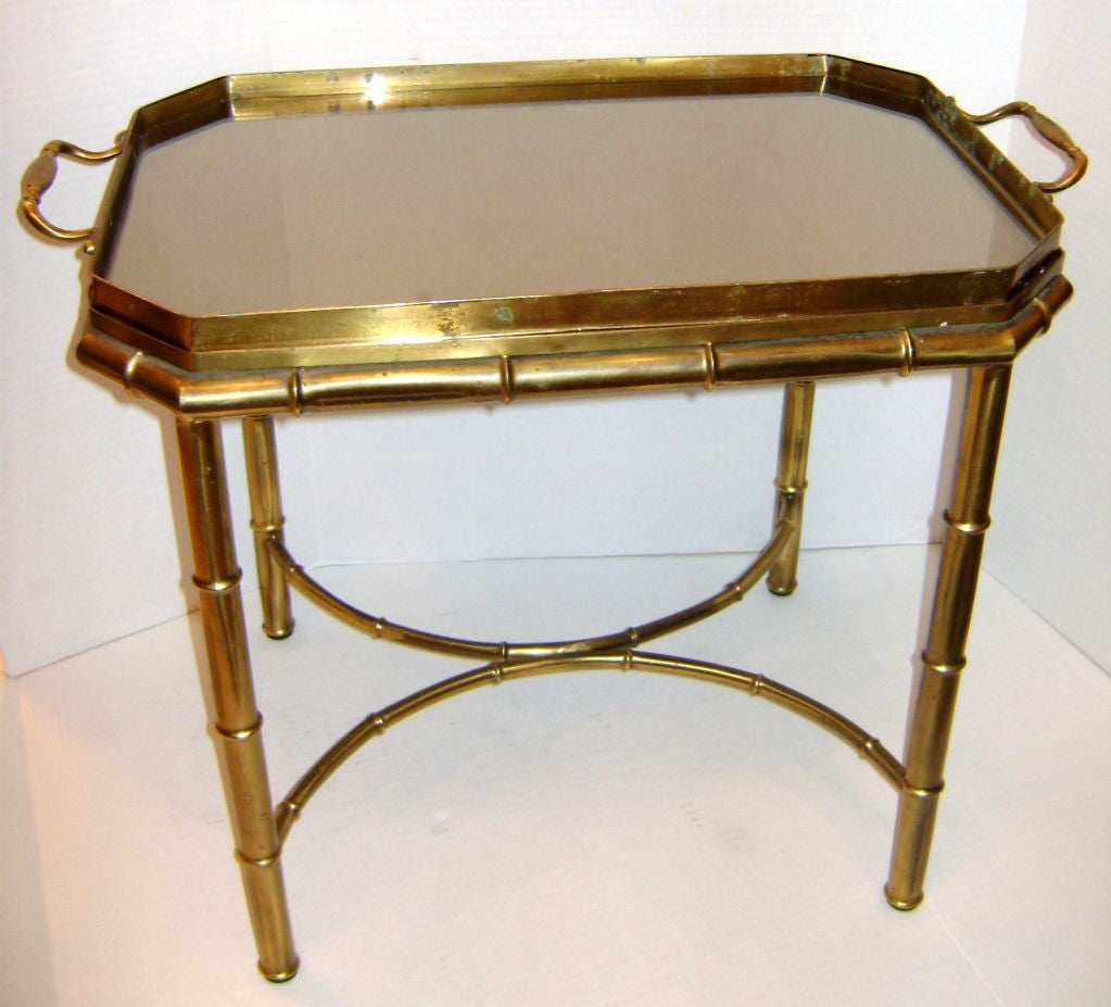 Mirrored top bamboo shaped tray coffee table with original patina.

27