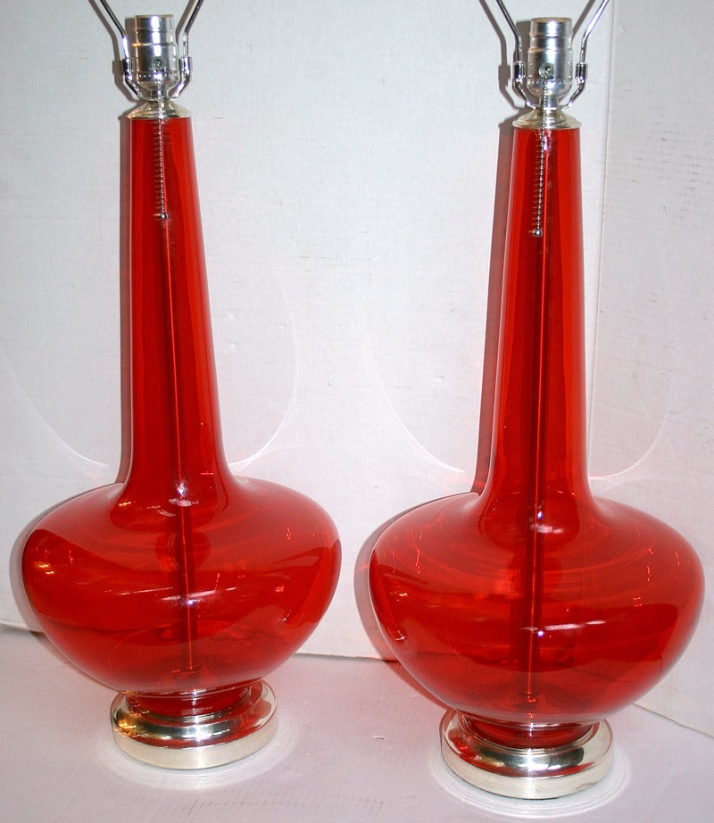 Pair of blown glass table lamps with nickel-plated bases.
Measurements:
23 1/4