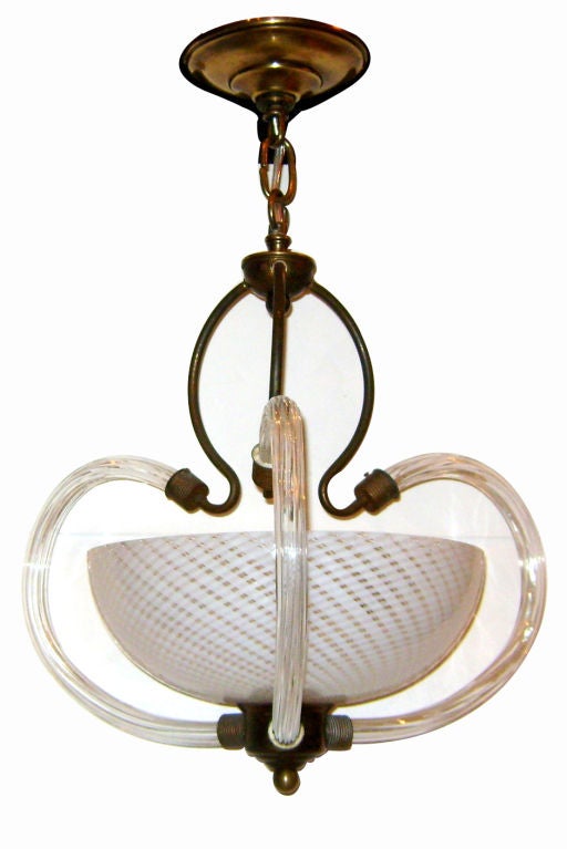 A Venetian light fixture with ribbon glass body and 3 interior lights, circa 1950.

Measurements:
Height (minimum drop): 19