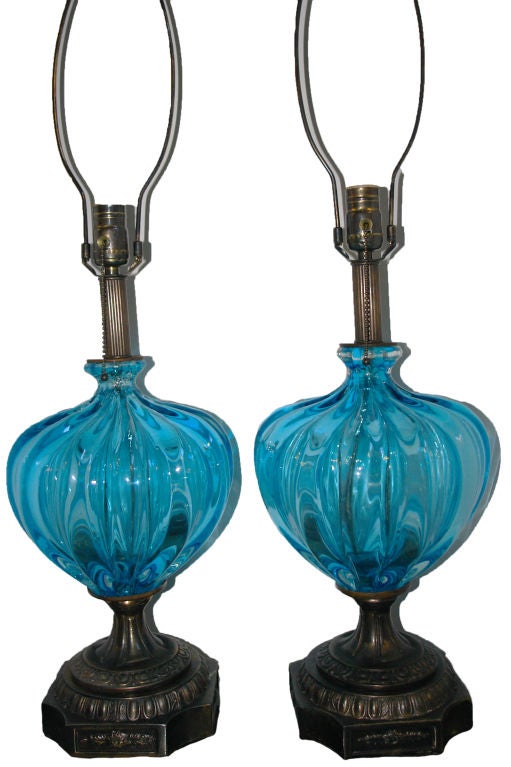 A pair of 1930s Italian blown glass Murano lamps with bronze bases.

Measurements:
Height of body 17