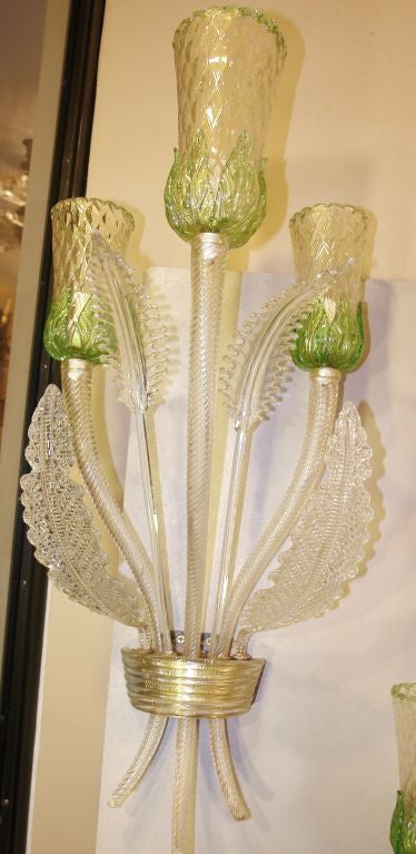 Set of four, circa 1940s Venetian glass sconces in foliage motif gold leaf and green detailing. Sold per pair.

Measurements: 
Height 33