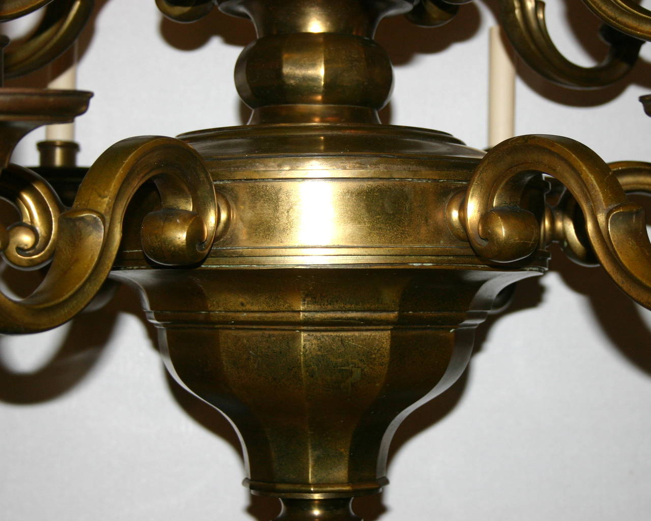 Dutch, circa 1920 double-tiered chandelier with twelve lights. Original patinated bronze finish.  
Measurements:
42 1/2" drop.
33 1/2" diameter.