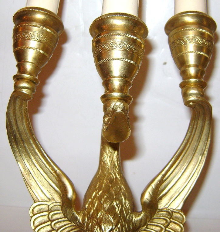 Pair of circa 1920's French empire style sconces with 3 lights.

Measurements:
Height: 16.5