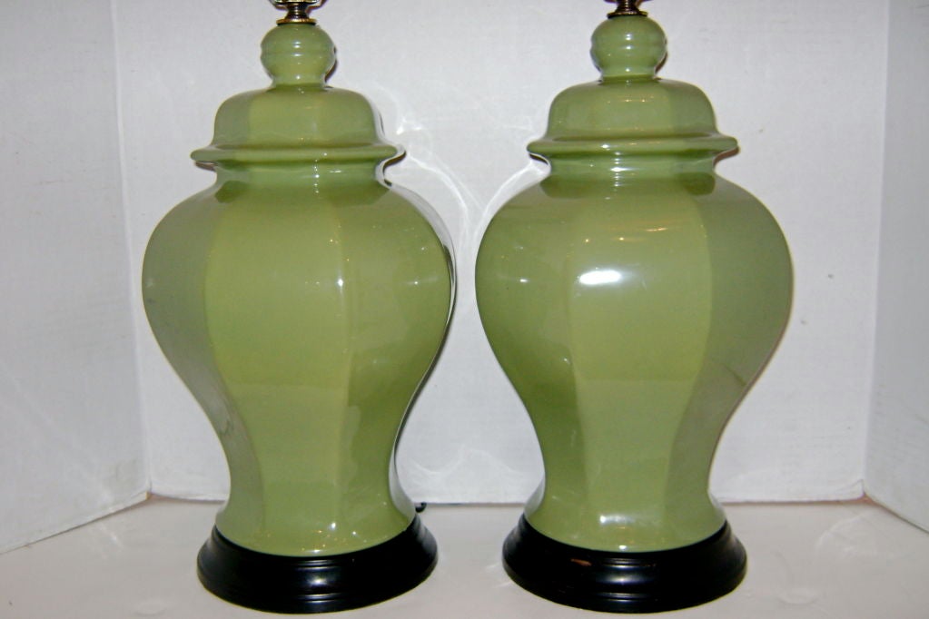 Pair of circa 1940's French celadon green ginger jar-shaped porcelain table lamps.

Measurements:
Height of Body: 16