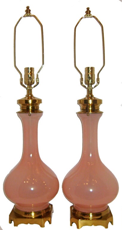 A pair of circa 1930s French pink opaline table lamps.

Measurements
Height of body 18
