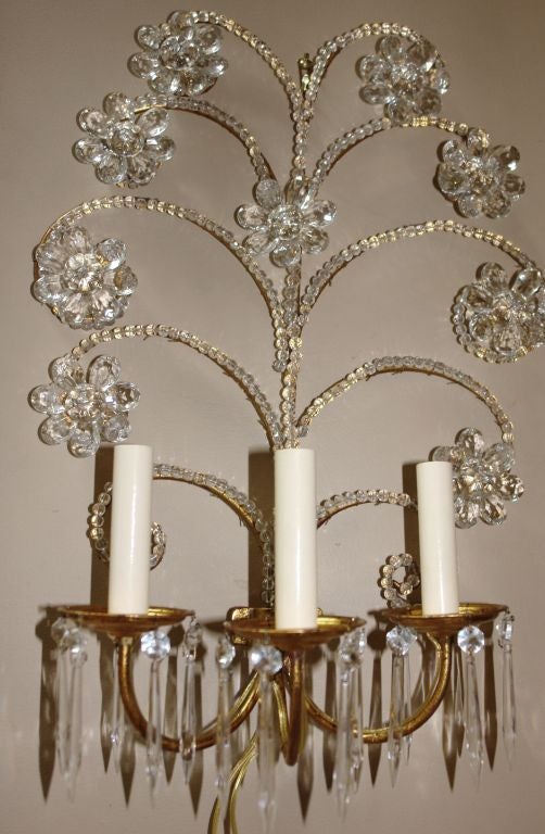 Pair of 1950s French gilt metal and beaded crystal sconces with three lights. With beaded body.
 