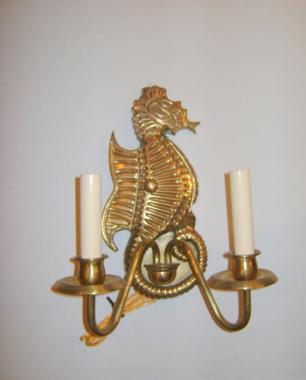A set of  4 Italian circa 1940's bronze sea horse shaped wall sconces with double light. Sold in pairs.

Measurements:
Height: 12