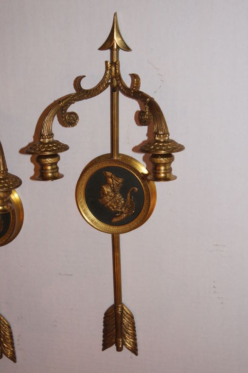 Pair of Italian circa 1920s neoclassic style sconces with arrow motif on backplate.

Measurements:
Height 19